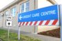 sign pointing to urgent care facility